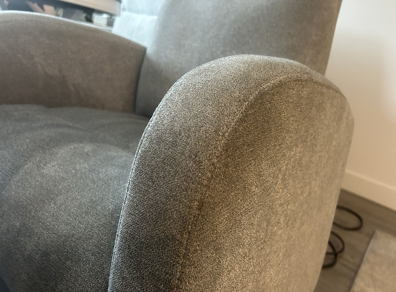 Recliner armrest with heavy soiling before professional upholstery cleaning in Kelowna