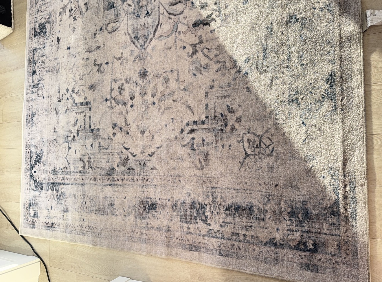 Viscose rug with heavy general soiling and dulled colours before hot water extraction in Kelowna