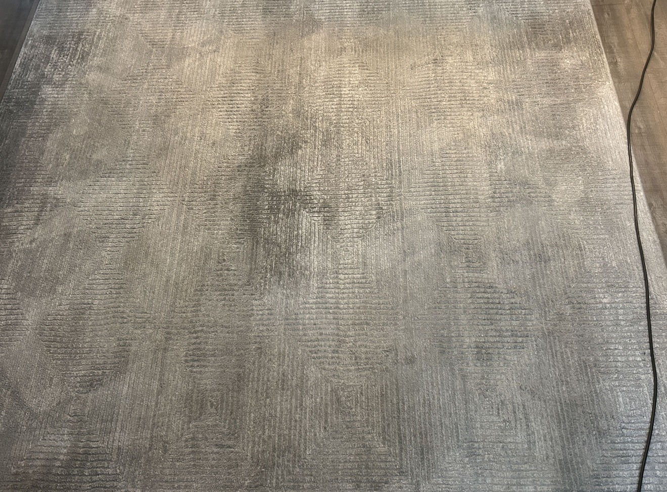 Synthetic rug with dull, soiled fibres before hot water extraction cleaning in Kelowna