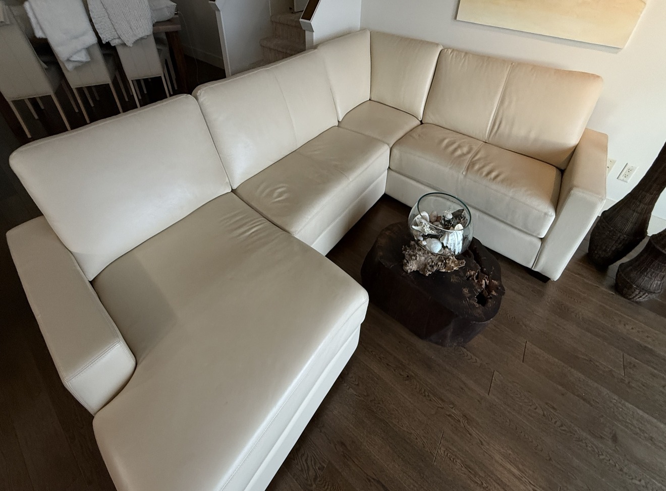 Full view of white leather L-shaped sectional sofa after professional cleaning and conditioning, consistent finish throughout