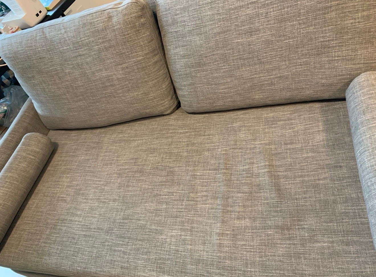 Love seat upholstery fully restored after blood stain removal by BreezeCo in Kelowna
